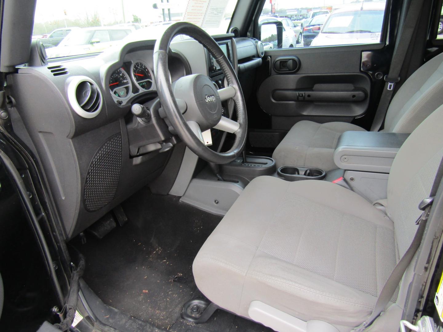 2008 Black Jeep Wrangler Unlimited Sahara 4WD (1J4GA591X8L) with an 3.8L V6 OHV 12V engine, Automatic transmission, located at 15016 S Hwy 231, Midland City, AL, 36350, (334) 983-3001, 31.306210, -85.495277 - Photo#3